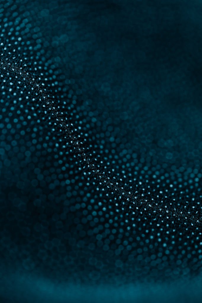 Captivating macro shot of textured blue fabric showcasing intricate details and patterns.