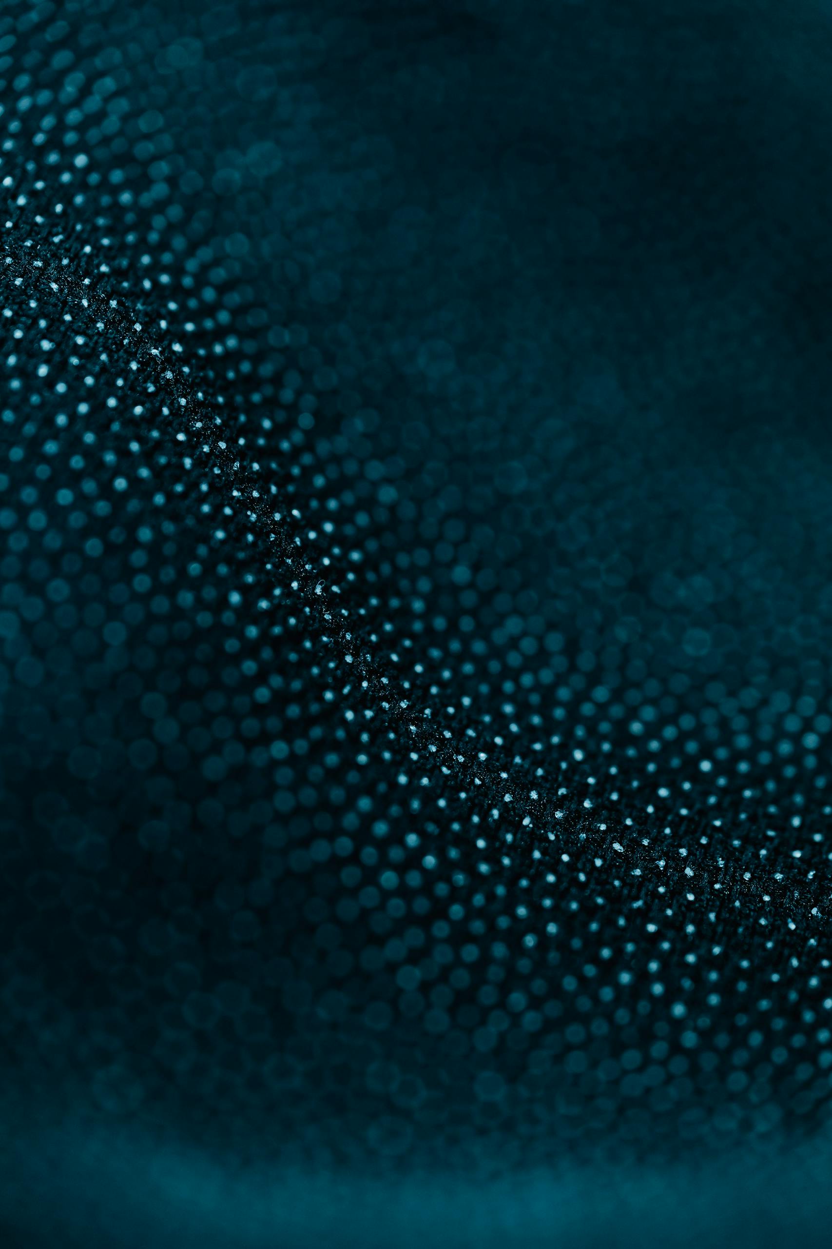 Captivating macro shot of textured blue fabric showcasing intricate details and patterns.